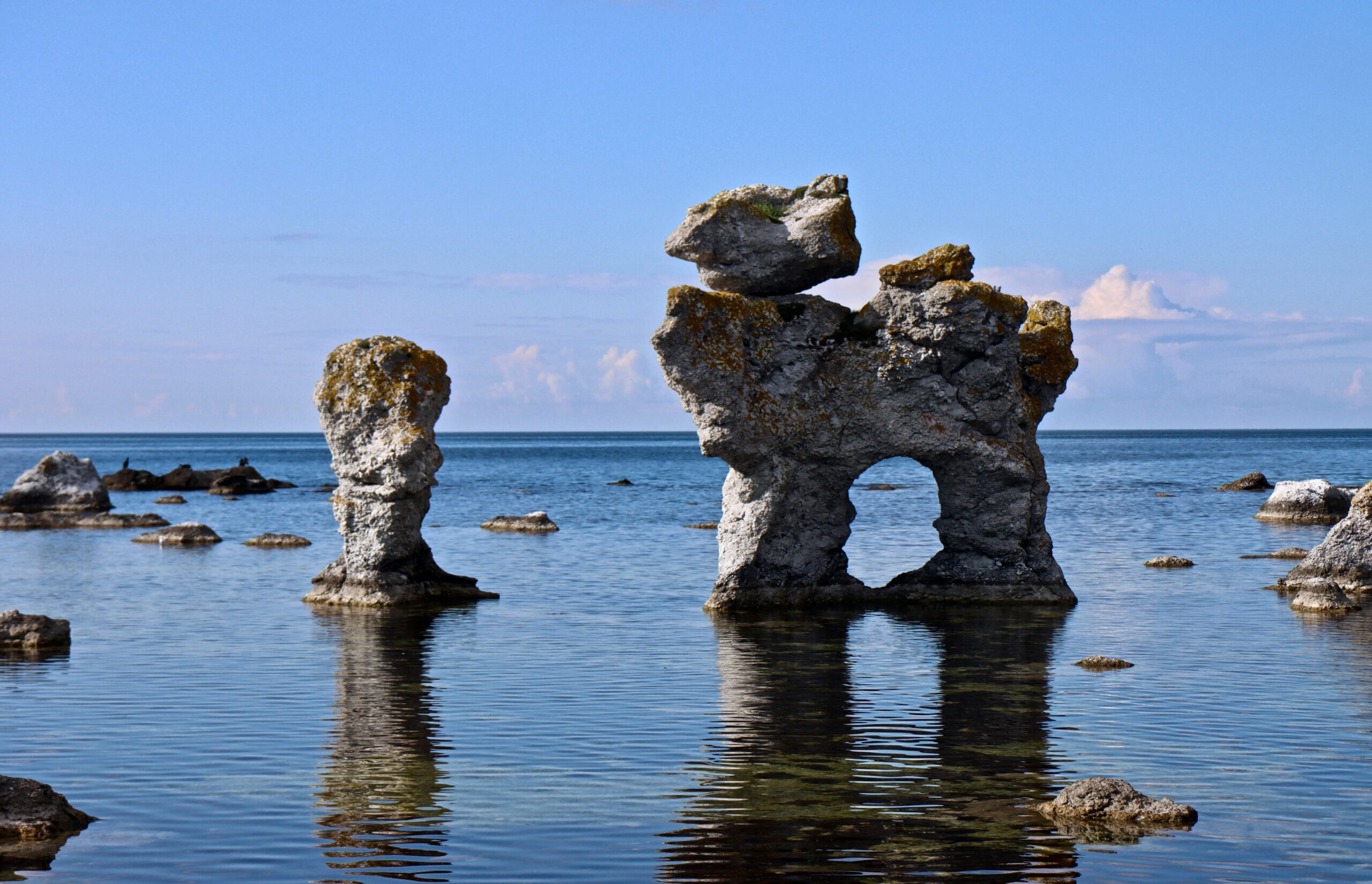 Limestone cliffs and historic ruins on Gotland island, a slow paced and scenic destination featured in this Scandinavia Travel Guide.