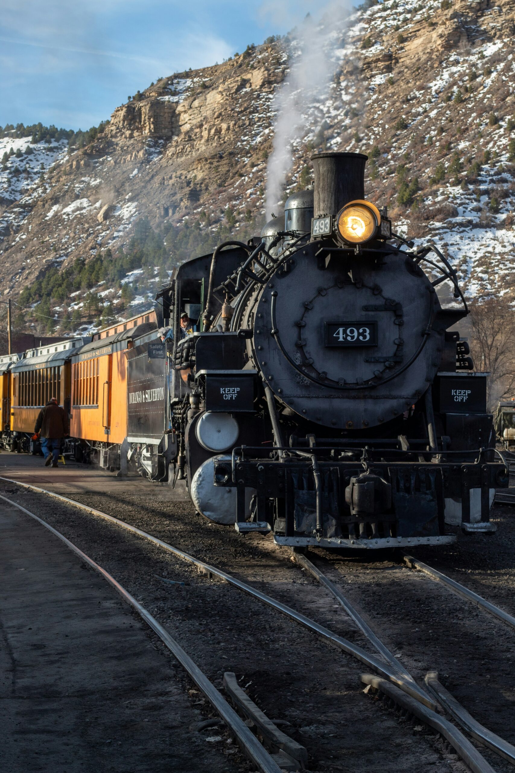 The historic steam train departing the depot in downtown Durango, serving as the perfect starting point for a San Juan Skyway road trip.